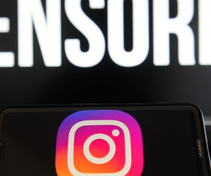 August 17, 2018 - Krakow, Poland - Instagram logo is seen on a Huawei smart phone with the word censored on a laptop monitor. (Credit Image: © Omar Marques/SOPA Images via ZUMA Wire)